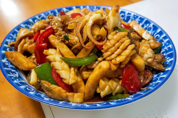 stock image A delicious Chinese home-cooked dish, stir-fried fresh squid with vegetable pepper