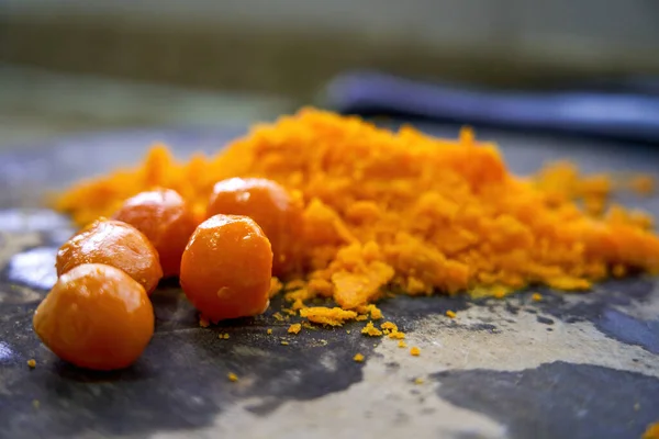 stock image A chef is chopping salted egg yolk in the kitchen