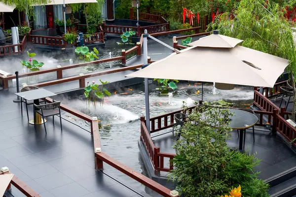 Luxurious Chinese garden restaurant seats and ancient building turret