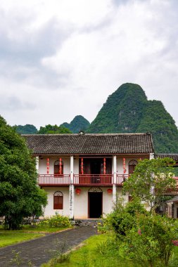 Longzhou 'da, Guangxi' de, Çin 'de, Yexiu Bahçesi' nde, Qing Hanedanlığı 'nın sonlarındaki güneydeki yerleşim birimlerinde.