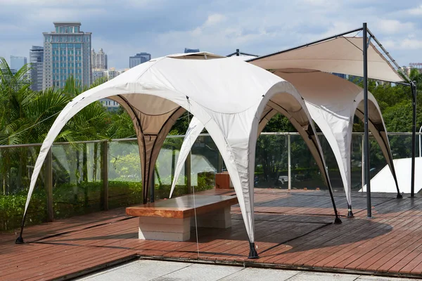 Canopy tent seating on the top floor of the city