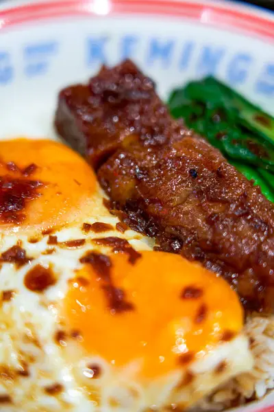 Delicious double egg barbecued pork rice in Hong Kong style tea restaurant