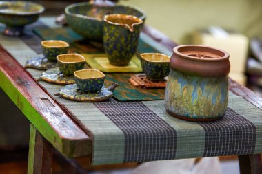 Close-up of exquisite and elegant Chinese purple sand ceramic tea cups and teapots clipart