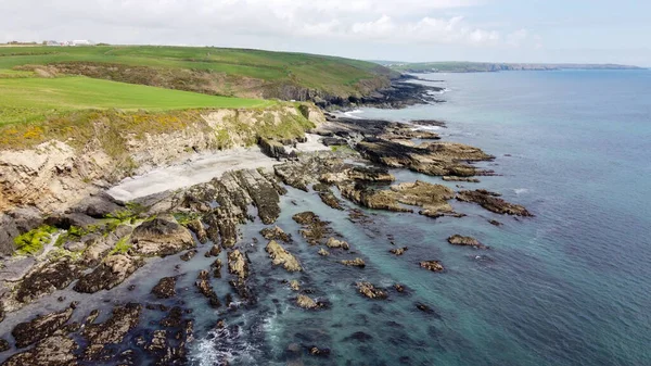 View from above. The coast of the island of Ireland. A rocky reef in the Celtic Sea. Beautiful coastline of northern Europe. Nature of Southern Ireland.