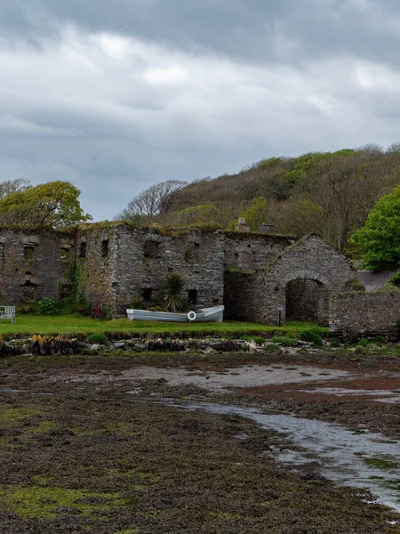 The ruins of Arundel grain store on the shore. An old stone building. Historical monument. Tourist attractions