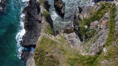 Seashore, view perpendicular from above. Beautiful sea rocks. The edge of the Atlantic Ocean. A natural attraction. Aerial photo. Drone point of view.