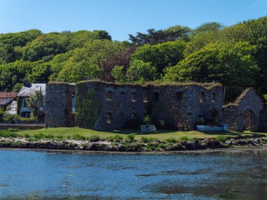 The ruins of stone grain store on the shore of Clonakilty Bay on a spring day. Irish landscape. The ruins of Arundel Grain Store near Clonakilty.
