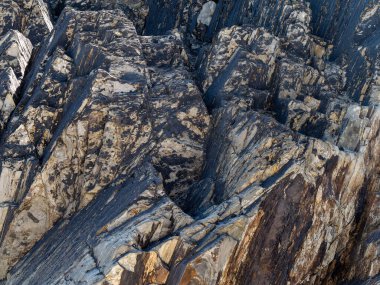 A variety of geological strata as a background, texture. Stone.