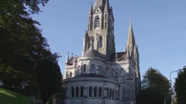 View of St. Fin Barre's Cathedral. Gothic Revival three-spire Church of Ireland cathedral in the city of Cork. The back side of the facade.