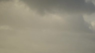 Time-lapse of a gray overcast sky with moving clouds