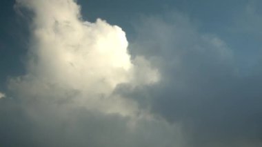 Fast-moving rain clouds, timelapse with cumulus clouds background.