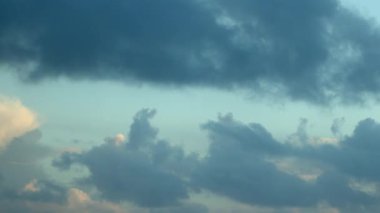 Pink and white clouds in the dawn sky, captured in a time-lapse video