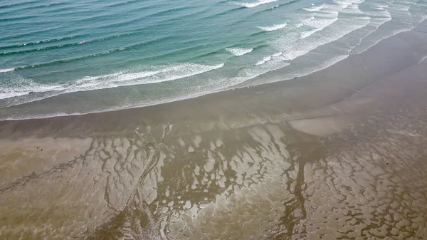 stock image coastal sand and sea waves, top view. Sandy beach and ocean tide. Seascape. Aerial view of ocean waves