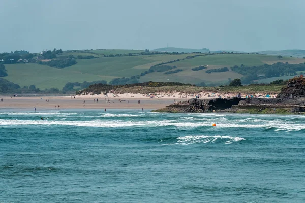 stock image The Irish are relaxing on the seashore near Clonakilty on a summer day. Inchydoney beach, sea.