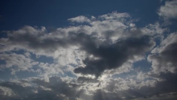 White Cumulus Clouds Obscure Sun Clear Blue Midday Sky Video — Stock Video