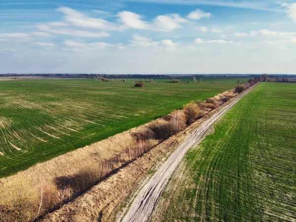Abandoned land reclamation canal in the field, aerial view. Agricultural landscape.