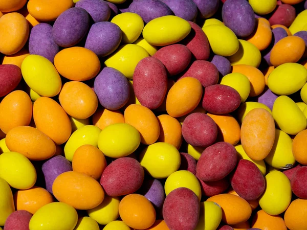 Close Pile Colorful Candy Coated Chocolates Purple Yellow Orange Red — Stock Photo, Image