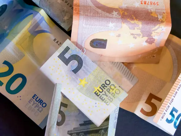 Stock image Economic Concept. A variety of Euro notes, representing financial diversity.