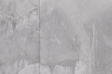 Gri desenli yüzeyi ve eklemleri olan sert beton yüzeyi