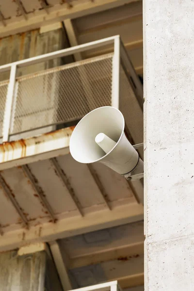 Electric loudspeaker on the wall to sound the alarm siren close-up