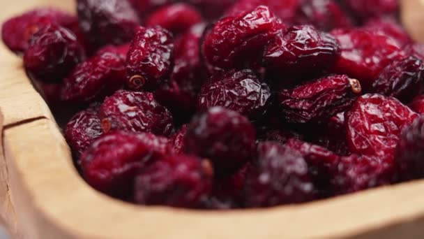 Dried Wrinkled Red Cranberry Berries Cracked Wooden Bowl Macro Rotation — Stock Video