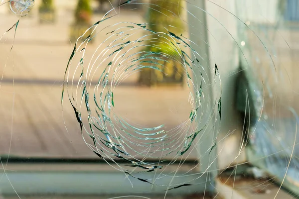 Broken glass construction with a round hole in the street