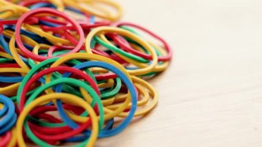 Colourful round rubber bands. Macro. Rotation