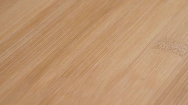 Brown wood grain texture close up. Rotation