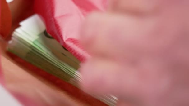 Bonus One Hundred Euro Banknotes Wrapped Red Gift Paper Hands — Stok video