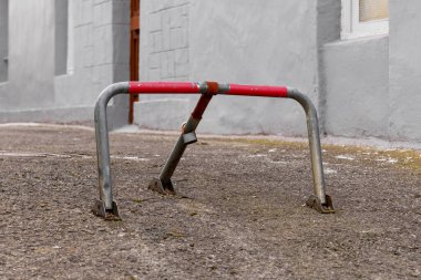 Closed parking metal barrier with padlock close up