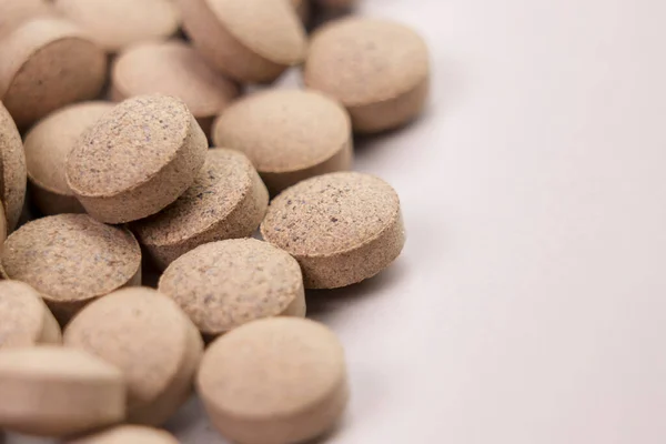 stock image Beer yeast pills on a white plate close up