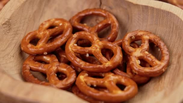 Bavarian Crispy Crackers Pretzels Rustic Wooden Bowl Rotation — Stock Video