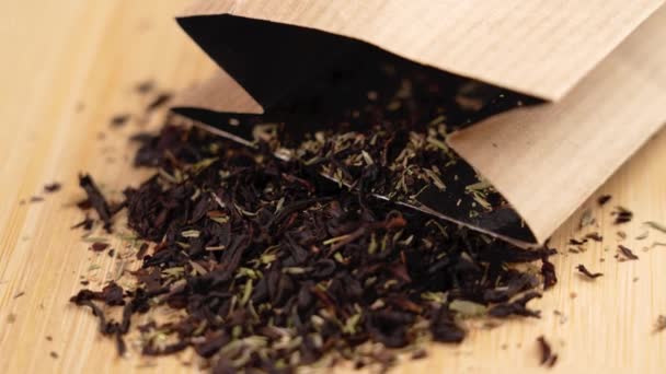 Black Tea Herbal Ingredient Scattered Paper Pack Wooden Eco Background — Stock Video