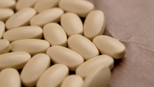 Farmaceutická Medicína Pilulky Textuře Hnědého Papíru Detailní — Stock video
