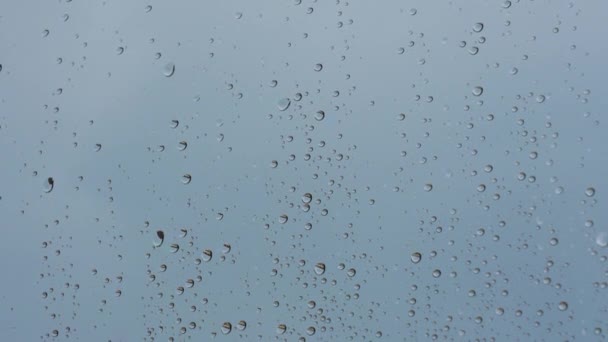 Raindrops Window Glass Sky Blue Background Dramatic View — Stock Video