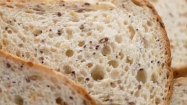 Çölyak tohumlu dilimlenmiş glütensiz beyaz ekmek. Sağlıklı beslenme. Makro. Döndürme