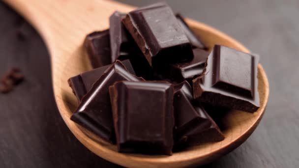 Pieces Black Bitter Chocolate Wooden Spoon Dark Brown Board Close — Stock Video