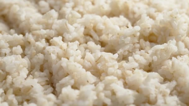調理した米のテクスチャを閉じます アジアの伝統料理 ローテーション — ストック動画