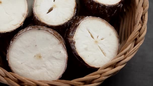 Organic Sliced Cassava Root Wooden Rattan Bowl Close Fresh Yucca — Stock Video