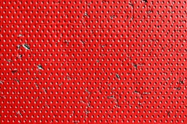 Kırmızı yaşlandırılmış yırtık yüzey noktalı desenli ve yırtık detaylarla dolu. Endüstriyel aşınmış çizik renk arkaplanı