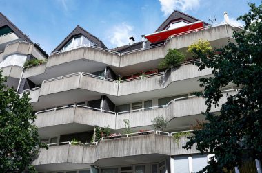 aged facade of a residential building made of exposed concrete
