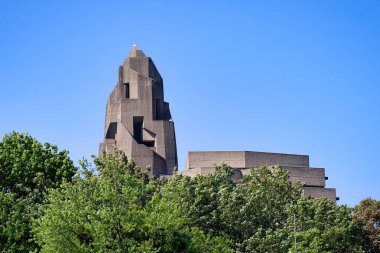 New construction of the Bensberg town hall from the 1960s with sculpturally shaped stair tower made of exposed concrete clipart