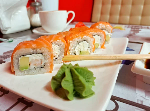 stock image Sushi with salmon and wasabi on a white plate. Japanese and Chinese food