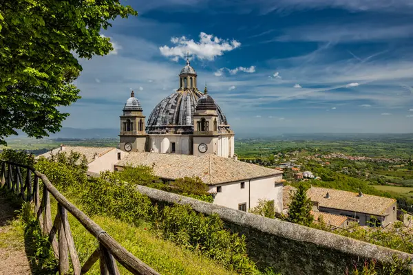 stock image A glimpse of the ancient medieval village of Montefiascone, Viterbo, Italy. The Cathedral of Santa Margherita, with its large dome and the two bell towers, with clocks, on the sides.