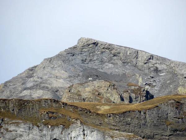 stock image Rocky alpine peak Piz Fluaz (2814 m) over the Panixersee lake and in the Glarus Alps mountain massif, Pigniu-Panix - Canton of Grisons, Switzerland (Kanton Graubuenden, Schweiz)