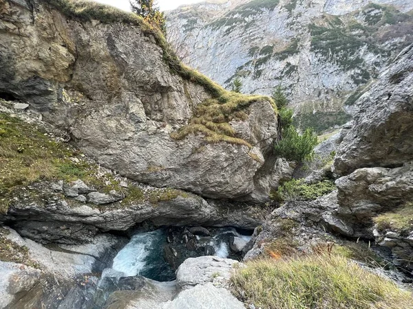 Stock image Aua dil Mer stream or Aua dil Mer creek (Aua dil Mer Bach) over the lake Panixersee (Lag da Pigniu) and in the Glarus Alps massif, Pigniu-Panix - Canton of Grisons, Switzerland (Kanton Graubuenden, Schweiz)