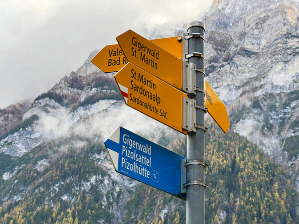 Mountaineering signposts and markings on the slopes of the alpine mountains above the Taminatal river valley and in the massif of the Swiss Alps, Vaettis - Canton of St. Gallen, Switzerland (Schweiz)