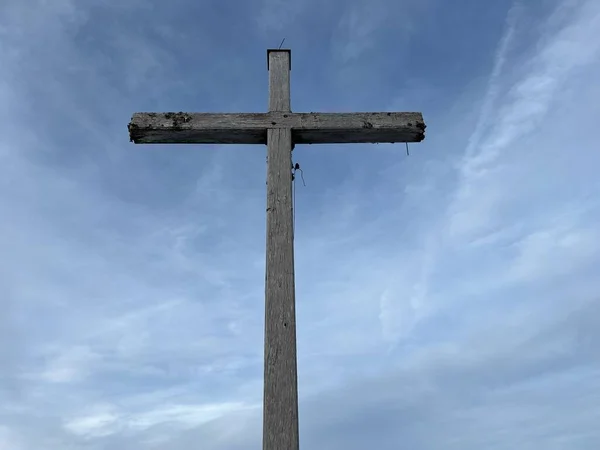 A wooden cross or Christian crucifix on top of the Swiss mountain Kronberg in the Appenzell Alps massif, Urnaesch (or Urnasch) - Canton of Appenzell Innerrhoden, Switzerland / Schweiz