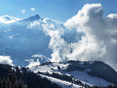 Beautiful low winter clouds and fog condensation in the Swiss Alps during a polar cold snap, Amden - Canton of St. Gallen, Switzerland / Schweiz
