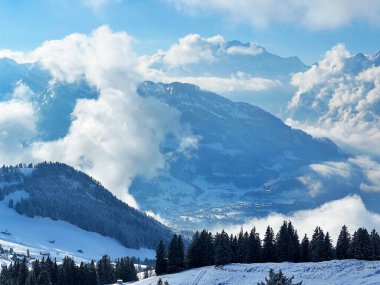 Beautiful low winter clouds and fog condensation in the Swiss Alps during a polar cold snap, Amden - Canton of St. Gallen, Switzerland / Schweiz